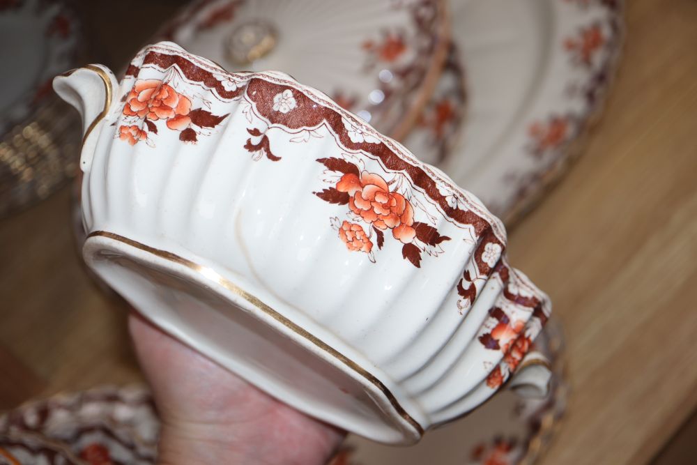 A Victorian Copeland part dinner service, transfer-printed with peonies and foliage in orange and brown,